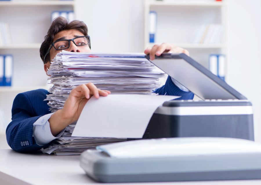 The,Businessman,Making,Copies,In,Copying,Machine
