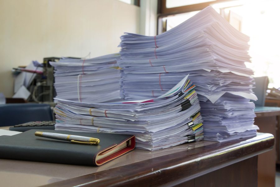 Business,Concept,,Pile,Of,Unfinished,Documents,On,Office,Desk,,Stack